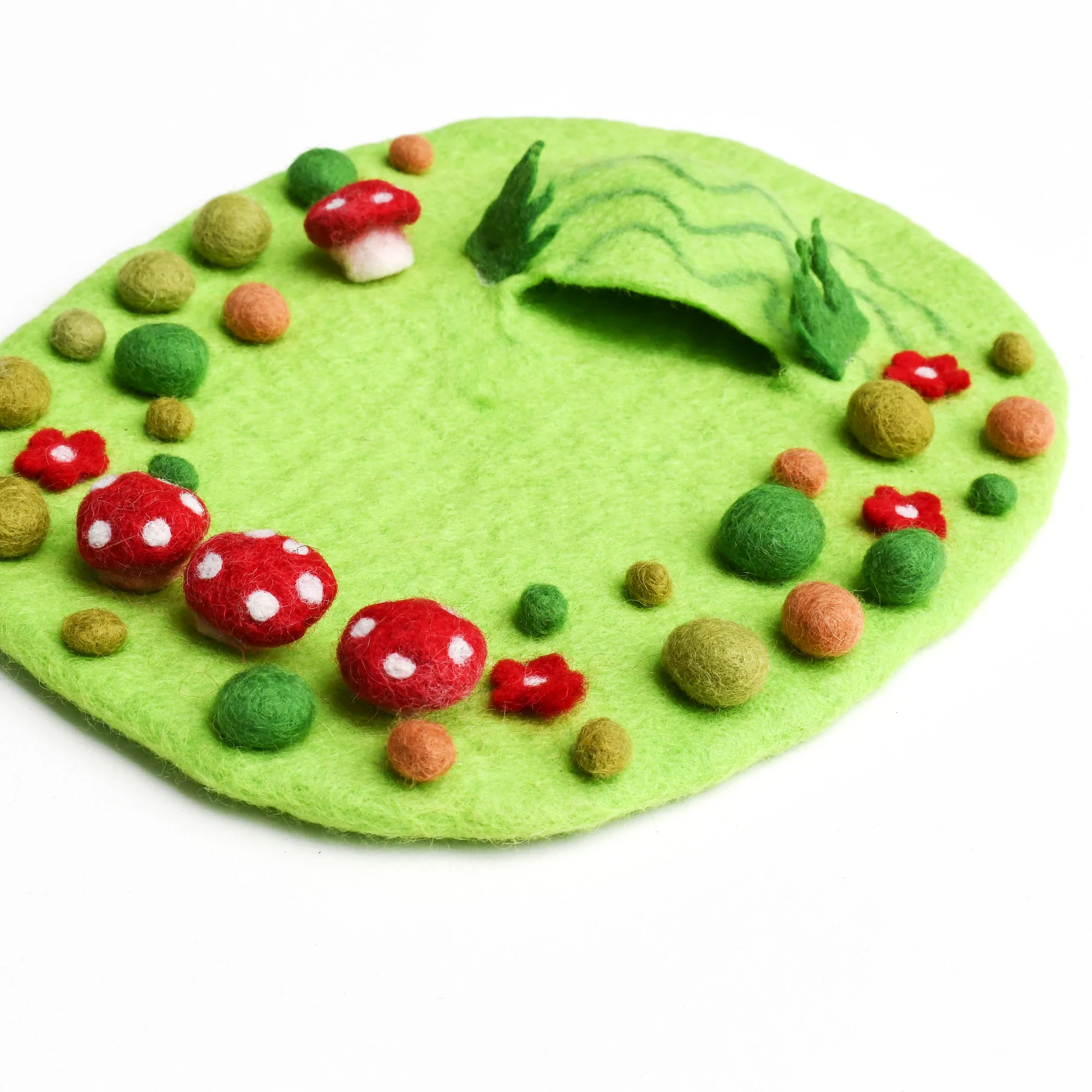 Folklore says fairies appear when there is a ring of toadstools. Our Fairy Toadstool Garden is made from wool felt and it features little toadstools, colourful rocks and a tiny cave for the critters to hide in.